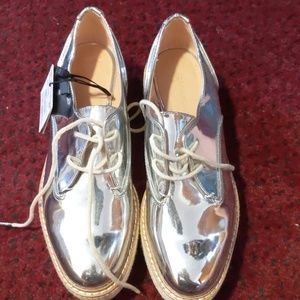 Silver oxfords. Never worn.